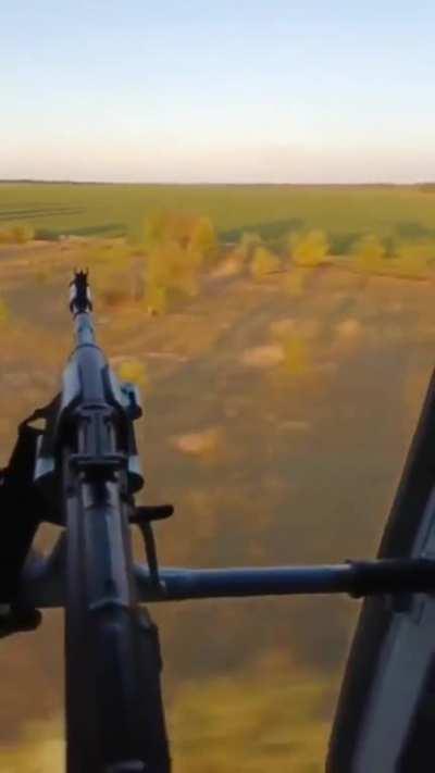 Ukrainian airborne flying low in a helicopter (to the tune of CCR) -- badass flying this low, also troops showing great morale