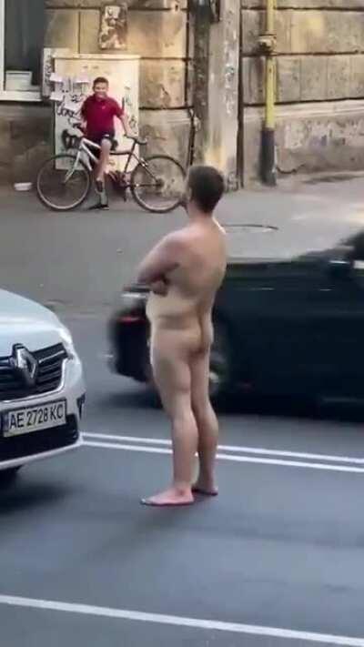 Something really gratifying about seeing a naked guy get knocked out for blocking traffic.