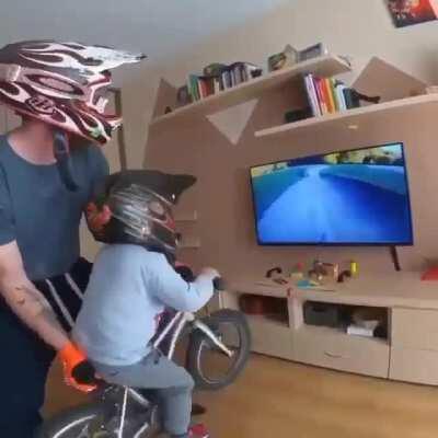 This dad giving the ultimate mountain biking experience to his son from home