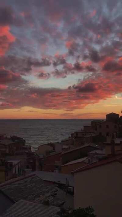 A beautiful sunset in the village of Riomaggiore in Cinque Terre, Italy.