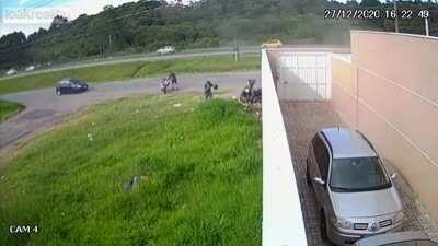 Motorcycle tries to go through brick wall.