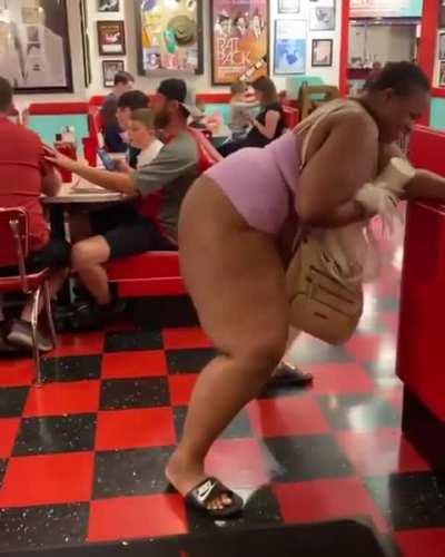 Woman twerks in front of family at restaurant