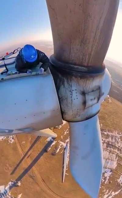 Maintenance work on a big wind turbine.