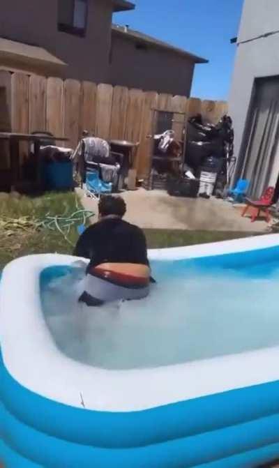 Kid thinks jumping in a kiddy pool from the roof is a good idea…