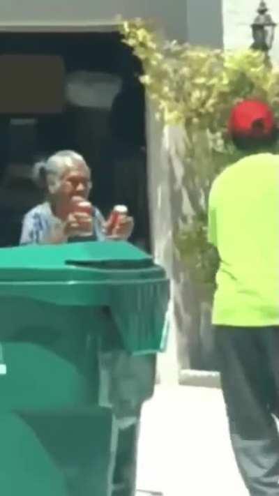 Bringing out some cold sodas for binmen on a hot day.