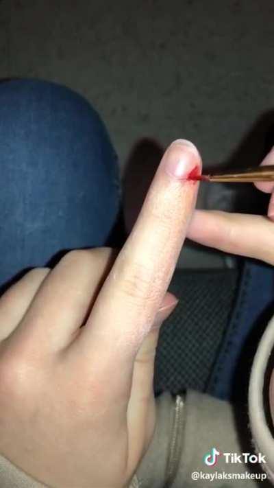 Pulling off a hang nail (by kaylaksmakeup)