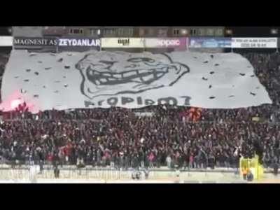 Football fans protesting flare ban with a poster and, of course, flares.