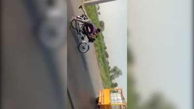 Guy Tries Stunt On Bike, Crashes Into Vehicle