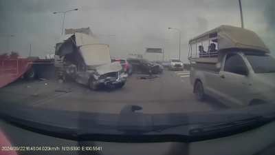 Out-of-control truck crashes through several cars along a highway in Thailand 