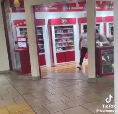 Suspected shoplifter gets banished to the phone store lockdown. 