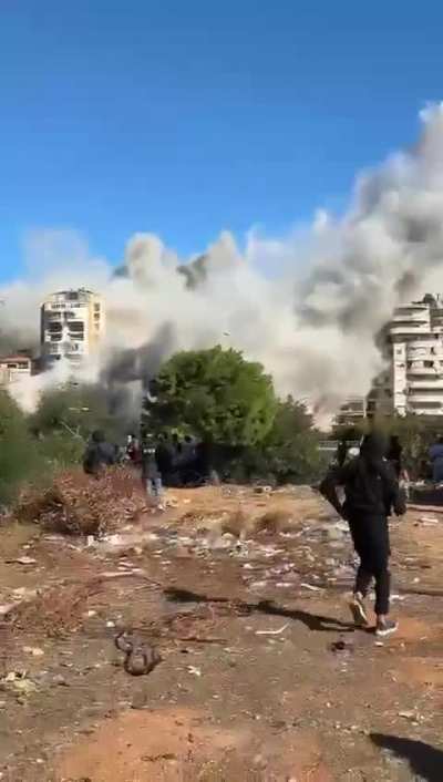 A building that has munitions for hezbollah stored under it getting striked in Dahye, Ghobiere. Missile visible in the video