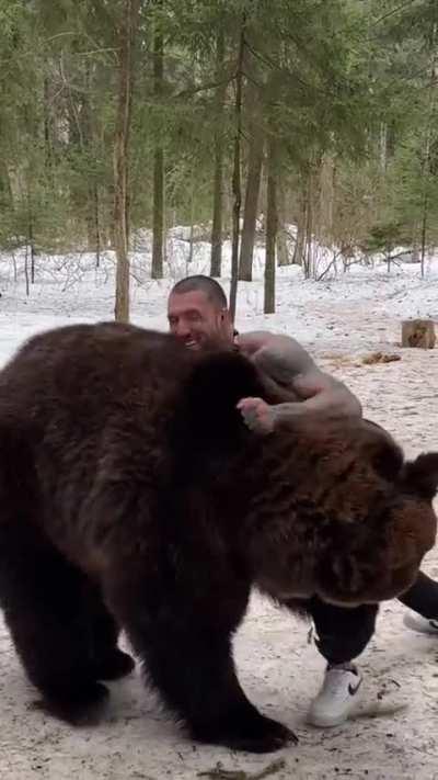 Guy seems to think he could control a bear...watch when it stands up