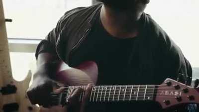 Tosin Abasi showing off his &quot;thumping&quot; technique