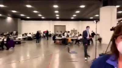 Windows are being boarded up at a Detroit absentee ballot counting center as poll watchers complain about a lack of transparenc