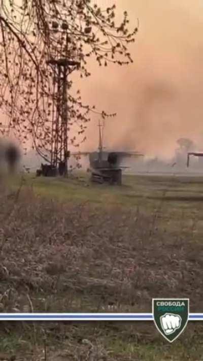 video from the Freedom of Russia Legion showing footage of russian partisan setting fire on a russian SU-24 somewhere in Novosibirsk