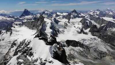 Footage I recorded from the summit of the Weisshorn (4506m). The mythical north faces of the Matterhorn and Dent Blanche are visible in the distance. Valais, Switzerland