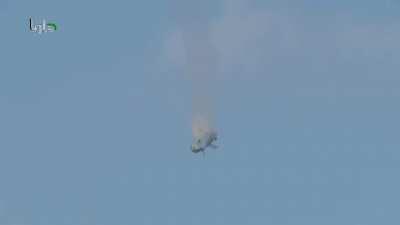 Syrian helicopter crashes to the cheers of people on the ground during the bombing campaign over Daraya - 1/16/2014