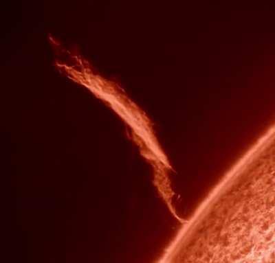 A solar flare at least 8-10 Earths tall.