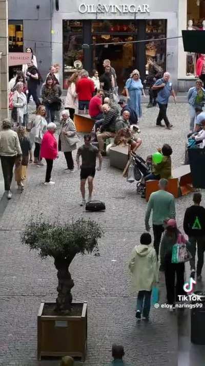 Man starts blasting music in the middle of the street