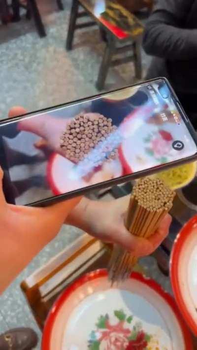 Chinese BBQ restaurants charges patrons by the skewer and use an app to tally up how many skewers you've had.