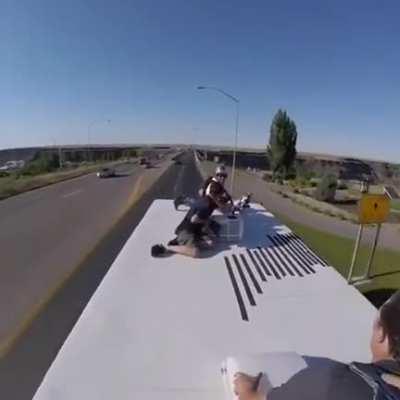 Parachuting off a truck driving over bridge