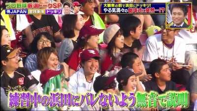 Hamada throws out the first pitch at a baseball game.