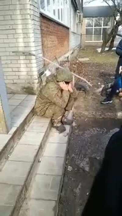 A young Russian soldier cries while the residents of Sumy, Ukraine tell him that he's not welcome in their country.