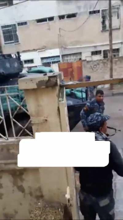 Iraqi policemen in a heavy street combat with isis fighter during the battle of Mosul,2016.