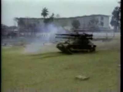 US Marines use their M-50 &quot;Ontos&quot; to lob shells across the Perfume River in Hue City, Vietnam (February 1968)