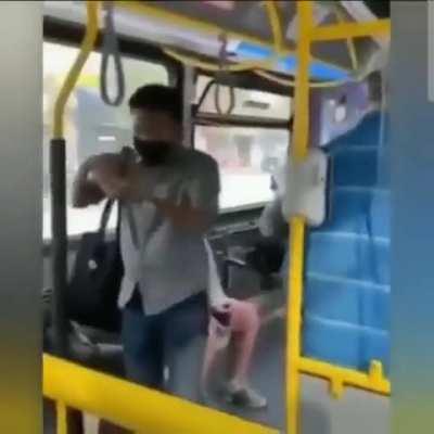 Man throws off the woman who spits on him from the bus