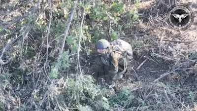 [Graphic] Russian soldier freezes up, then gets hit with an FPV drone which leaves a large gaping wound