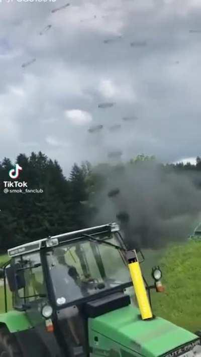 A tractor making perfect smoke rings from its exhaust pipe