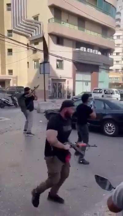 Hezbollah/Amal fighter firing a RPG rocket at the wrong building.