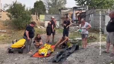 A family and children cry near a woman killed in a Russian airstrike. Kharkiv Region, 30.08.2024 