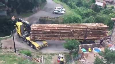 Truck with rear steerable dolly crossing a narrow bridge. video playback speed x3