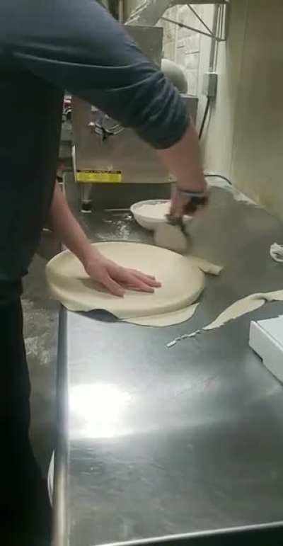 Full process of me hand rolling pizza crust at my job :)