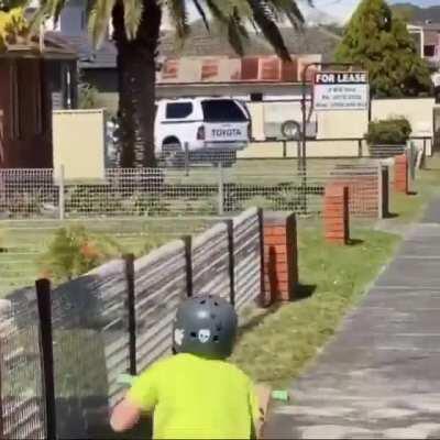 This girl enjoying a leisurely scoot along the footpath