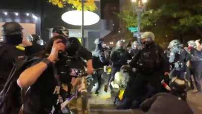 [Portland, OR] Oregon state police bull rush and push one woman to the ground and violently tackle another before making arrests.
