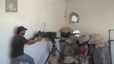 Al-Rahman fighter tosses a pair of improvised explosives into a basement during intense urban combat in Ein Tarma - 2017