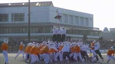 Japanese game knocking guy off pole to win.