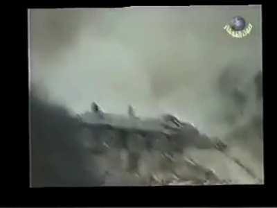 Chechnya: Russian invaders fly into the air after their BTR hits a Chechen IED/mine. Chechnya,  [exact date and location unknown]