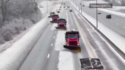 Team of snowplows clears ice off Kentucky interstate