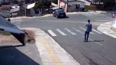 Man stops a car from crashing by jumping in it