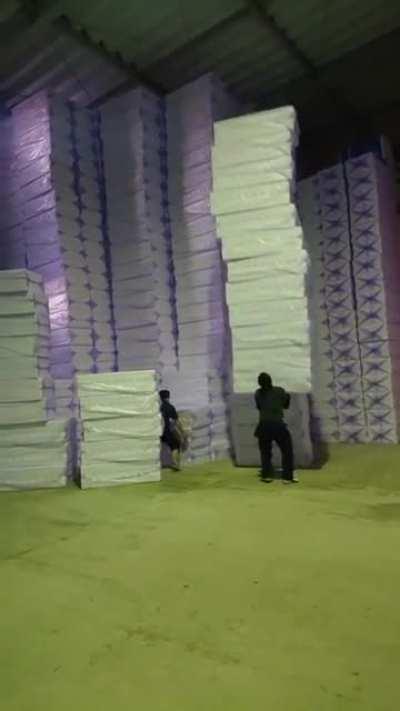 Moving packs of styrofoam by hand