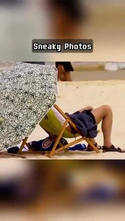 Pervert gets caught touching himself after taking photos of topless women at the beach.