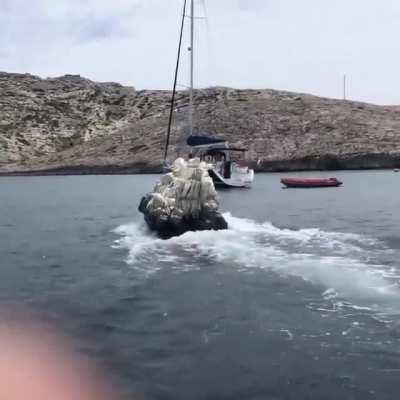 This boat shaped like a rock.