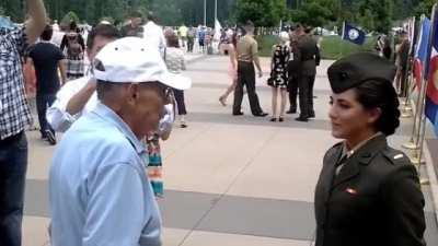 Veteran Grandfather's first salute to Granddaughter.