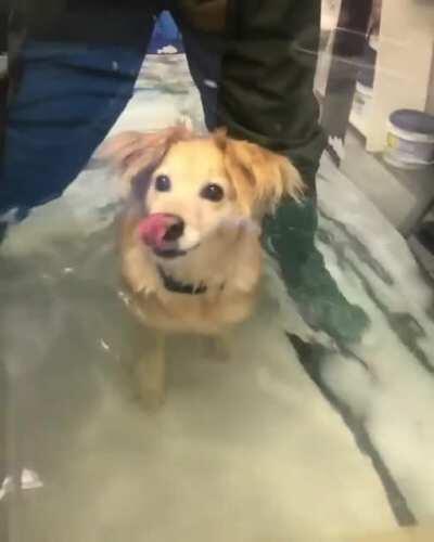 Good girl doing her hydro therapy with a smile