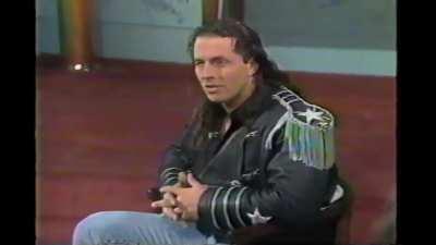 A young 19 year old Edge and Joe E. Legend ask WWF champion Bret Hart about trying to get signed to the WWF in 1992 on a talk show.