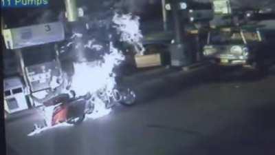 Man overfills a his motorcycle while it's running and burn